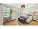 Sunlit main bedroom with hardwood floors, stylish decor, and ample natural light at 2815 W Estrella St, Tampa, FL 33629