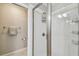 Clean and bright shower with tile, glass enclosure, and toiletry storage at 2815 W Estrella St, Tampa, FL 33629