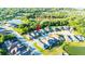 Aerial view highlighting a property in a residential neighborhood, showcasing its location near community amenities at 30647 Walker Cup Pl, Wesley Chapel, FL 33543