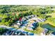 An aerial shot of a home within a residential community, showcasing nearby streets and surrounding greenery at 30647 Walker Cup Pl, Wesley Chapel, FL 33543