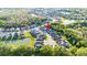 Aerial view of a home situated within a residential area, showcasing surrounding neighborhood and natural landscape at 30647 Walker Cup Pl, Wesley Chapel, FL 33543