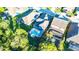 Aerial view of a beautifully landscaped property showcasing a backyard pool and outdoor living space at 30647 Walker Cup Pl, Wesley Chapel, FL 33543