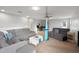 This bonus room has multiple sofas, a hanging hammock, and a space for an office at 30647 Walker Cup Pl, Wesley Chapel, FL 33543