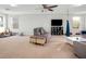 This expansive bonus room provides ample seating and natural light from the three windows at 30647 Walker Cup Pl, Wesley Chapel, FL 33543