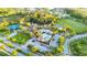 An aerial view showcases a community pool, tennis courts, clubhouse and recreation area, perfect for active living at 30647 Walker Cup Pl, Wesley Chapel, FL 33543