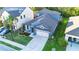 Charming blue two-story home with a well-manicured lawn and attached two-car garage at 30647 Walker Cup Pl, Wesley Chapel, FL 33543