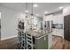 Open kitchen with a central island, pendant lights, stainless steel appliances, and lots of cabinets at 30647 Walker Cup Pl, Wesley Chapel, FL 33543