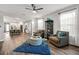 Charming living room with open design and seamless flow to kitchen at 30647 Walker Cup Pl, Wesley Chapel, FL 33543