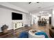 Open concept living room featuring wood floors and lots of natural light at 30647 Walker Cup Pl, Wesley Chapel, FL 33543