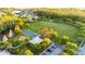 Beautiful aerial view of a park with a covered playground, parking, basketball court, green space and walking path at 30647 Walker Cup Pl, Wesley Chapel, FL 33543