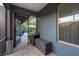 Screened patio with stylish brick flooring leads to a pool with tropical landscaping at 30647 Walker Cup Pl, Wesley Chapel, FL 33543