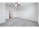 This bedroom features carpet, a ceiling fan, and ensuite bathroom at 31764 Griffin Sands Ln, San Antonio, FL 33576