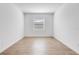 The bedroom features modern wood-look tile floors, a window and is freshly painted at 31764 Griffin Sands Ln, San Antonio, FL 33576