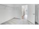 Carpeted closet with metal shelving, white walls, and open doorway to a hallway with light wood floors at 31764 Griffin Sands Ln, San Antonio, FL 33576