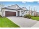 A well-manicured lawn leads to the front of the home, complete with a brick-paved driveway at 31764 Griffin Sands Ln, San Antonio, FL 33576