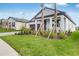Well-maintained lawn features young palm trees and shrubs in front of this home with a two-car garage at 31764 Griffin Sands Ln, San Antonio, FL 33576