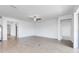 Open concept living space features luxury vinyl flooring, neutral paint, and access to other rooms at 31764 Griffin Sands Ln, San Antonio, FL 33576