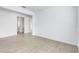 Spacious living room has luxury vinyl plank flooring and neutral paint throughout at 31764 Griffin Sands Ln, San Antonio, FL 33576