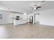 Open concept floor plan featuring a contemporary kitchen and spacious living area with vinyl flooring at 31764 Griffin Sands Ln, San Antonio, FL 33576