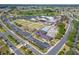 Aerial view highlighting community amenities like lawn bowling, pools, and recreational facilities at 334 Northway Dr, Sun City Center, FL 33573