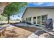 Backyard with stone patio, landscaping, and open space off of the rear of the home at 334 Northway Dr, Sun City Center, FL 33573