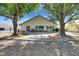 The backyard showcases mature landscaping with a stone patio area and adjacent yard at 334 Northway Dr, Sun City Center, FL 33573