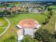 Overhead shot of well-maintained baseball field surrounded by lush green space and trees at 334 Northway Dr, Sun City Center, FL 33573
