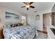 Bedroom featuring beach themed decor, ceiling fan and a double closet at 334 Northway Dr, Sun City Center, FL 33573
