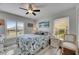 Bedroom featuring sunny windows, ceiling fan and a double closet at 334 Northway Dr, Sun City Center, FL 33573