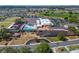 Aerial shot showcasing community amenities including a pool, lawn bowling, and parking areas at 334 Northway Dr, Sun City Center, FL 33573