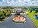 Aerial shot of Sun City Center Veterans Memorial and Community Hall entrance with pond at 334 Northway Dr, Sun City Center, FL 33573