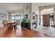 Welcoming foyer featuring wood and tile flooring, tall ceilings, and an adjacent dining room at 334 Northway Dr, Sun City Center, FL 33573