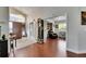 Grand foyer with high ceilings, wood floors, statement lighting and a decorative grandfather clock at 334 Northway Dr, Sun City Center, FL 33573