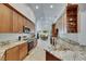 Kitchen featuring stainless appliances, granite countertops, and an adjacent dining area at 334 Northway Dr, Sun City Center, FL 33573