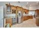 Spacious kitchen with stainless steel appliances, wine cooler, and ample cabinet storage at 334 Northway Dr, Sun City Center, FL 33573