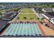 Aerial view featuring lawn bowling and shuffleboard courts with seating and landscaping at 334 Northway Dr, Sun City Center, FL 33573