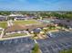 Aerial view showcasing community library, lawn bowling area and convenient parking at 334 Northway Dr, Sun City Center, FL 33573