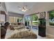 Inviting living room with large windows, a vaulted ceiling and backyard views and access at 334 Northway Dr, Sun City Center, FL 33573