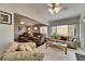 Comfortable living room features vaulted ceilings, tile flooring, and plenty of natural light at 334 Northway Dr, Sun City Center, FL 33573