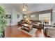 Open living room featuring wood floors, plush seating, and lots of natural light at 334 Northway Dr, Sun City Center, FL 33573