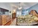 Tranquil main bedroom with hardwood floors, ample dresser space, and relaxing ambiance at 334 Northway Dr, Sun City Center, FL 33573
