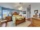 Comfortable main bedroom boasting a king-size bed, natural light, and stylish décor at 334 Northway Dr, Sun City Center, FL 33573