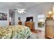 Bright main bedroom featuring wood furnishings and decor, with an open en suite at 334 Northway Dr, Sun City Center, FL 33573