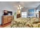 Cozy main bedroom with warm tones, hardwood flooring, and decorative accents at 334 Northway Dr, Sun City Center, FL 33573