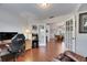 Bright office area with wood floors, an arcade game, and french doors to the dining room at 334 Northway Dr, Sun City Center, FL 33573