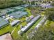 Aerial view shows tennis courts, pickleball courts, and Sun City Center clubhouse at 334 Northway Dr, Sun City Center, FL 33573