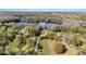 Sprawling estate on the lake, accessible by long driveway at 3607 Berger Rd, Lutz, FL 33548