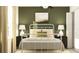 Serene bedroom featuring a cozy bed and black modern nightstands at 4023 Northern Key Dr, Plant City, FL 33563