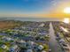 Beautiful aerial shot of waterfront neighborhood homes on canals with sunset, reflecting coastal living at 4116 Diaz Ct, Hernando Beach, FL 34607