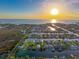 Expansive aerial view of a waterfront community near the coast at sunset at 4116 Diaz Ct, Hernando Beach, FL 34607